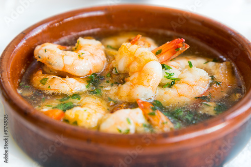 Gambas Pil Pil (Sizzling prawns with chili and garlic). Traditional Spanish tapas dish.