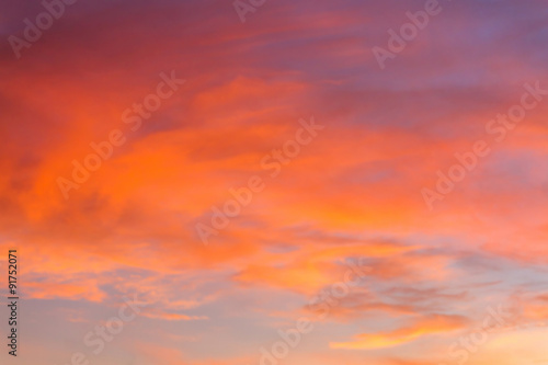 Dramatic sunrise sky with clouds.Blur or Defocus image. © ronnarong