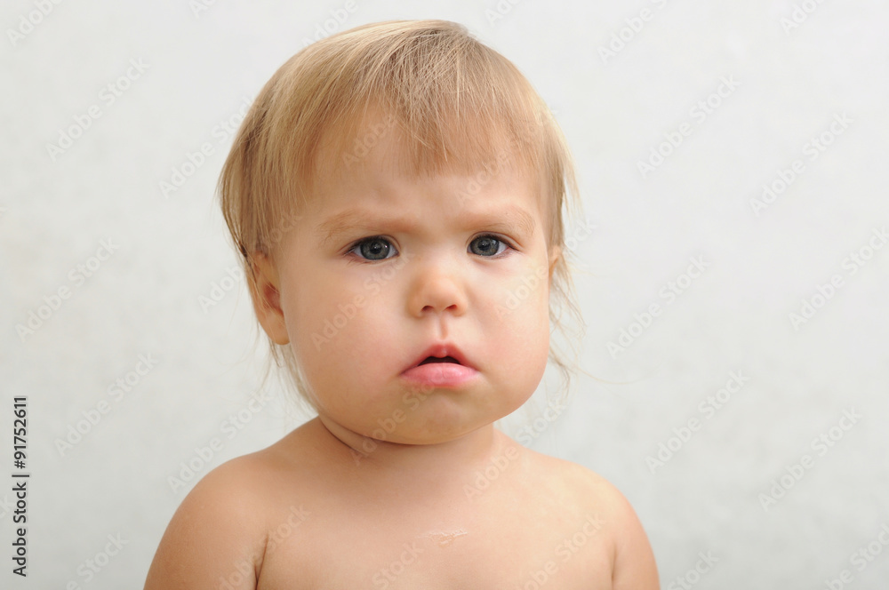 Unhappy baby portrait