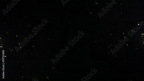 chaotic motion of luminous objects on a black background