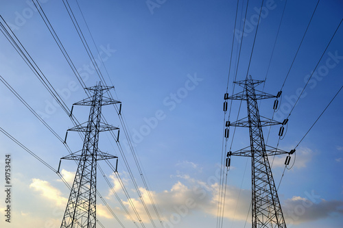 electricity pylons silhouetted