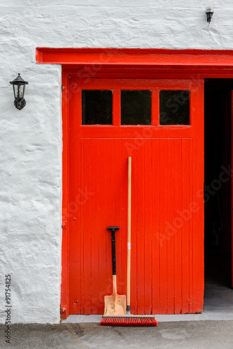 Red door to the still room at Edradour distillery in Perthshire, Scotland. photo