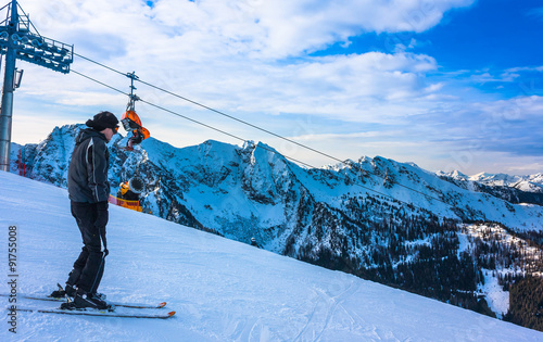Young skier at mountains ski resort in Austria