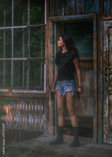 Beautiful young woman with two gun