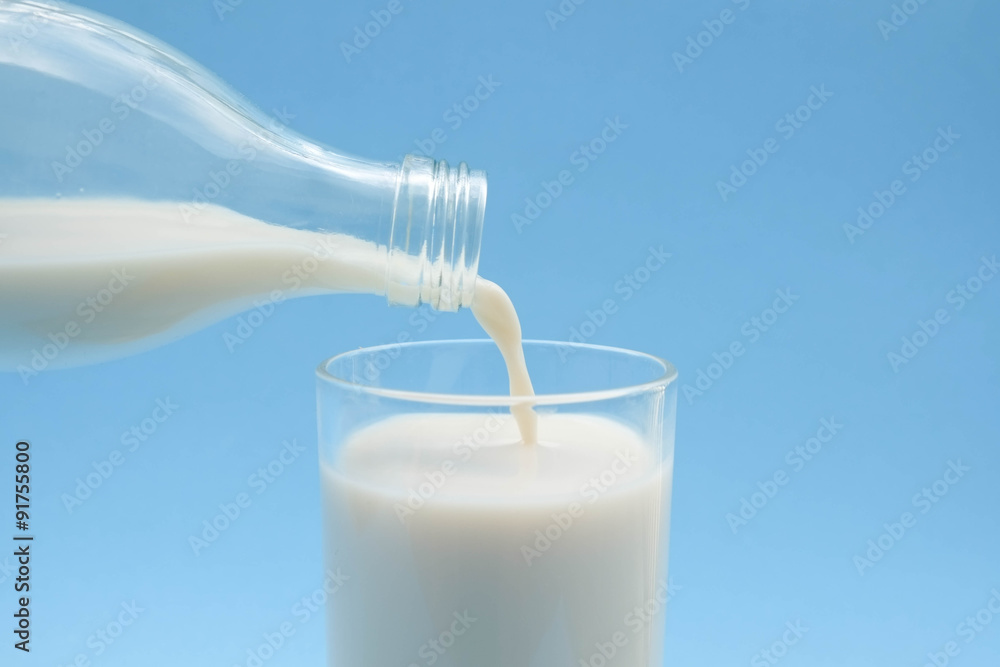 with milk on blue background with milk on blue background