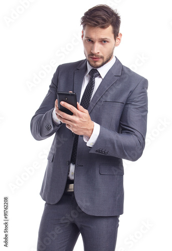 Cool businessman talking on mobile phone