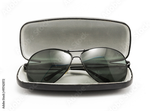 sunglasses in black opened case isolated on white