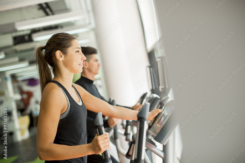 Young people training in the gym Young people training in the gym