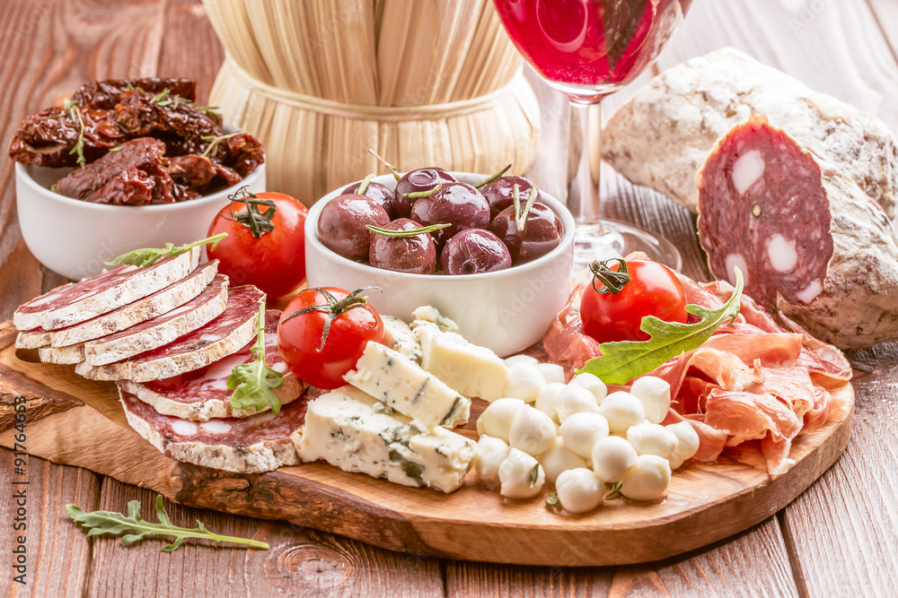 Wine snack set. Variety of cheese and meat on dark background. Wine snack set. Variety of cheese and meat on dark background.