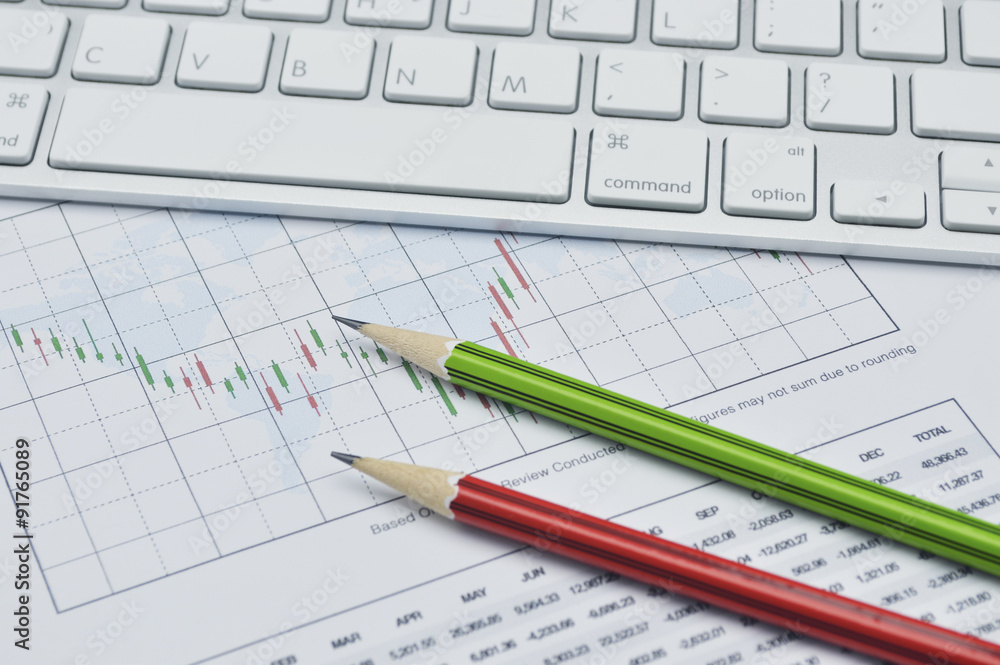 Pencil on business graph, stock market concept Pencil on business graph, stock market concept