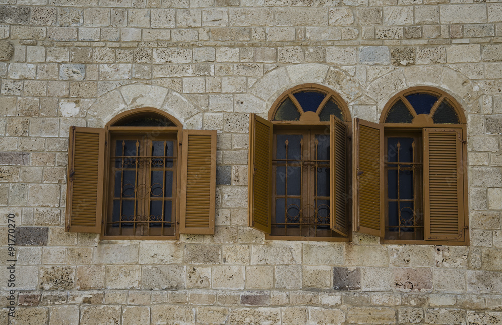 Windows with shuttered in stone wall Windows with shuttered in stone wall