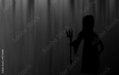 Halloween Grim Reaper silhouettes blur abstract background.