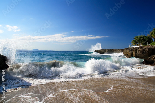 Ocean with waves and rocks on caribbean beach