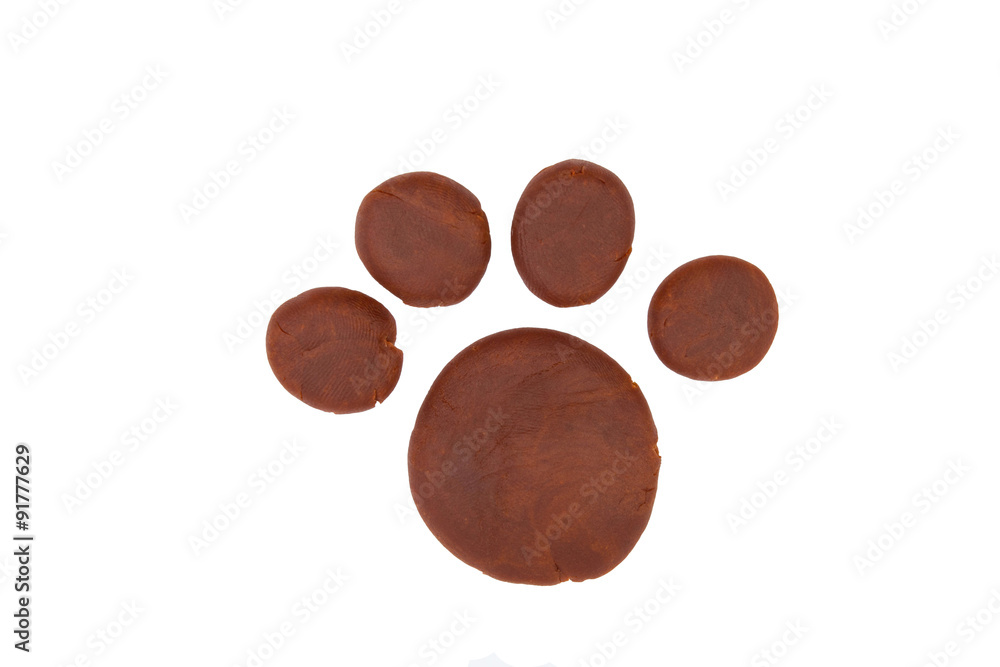 Paw from children bright plasticine - Stock Image macro. Paw from children bright plasticine - Stock Image macro.
