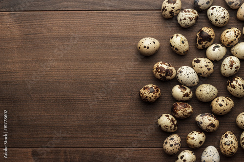 quail eggs on the brown wooden table