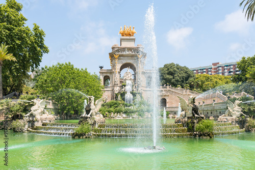 The golden Quadriga on the top of the Font de la Cascada in the Parc de la Ciutadella. The Park, established during the mid-19th, situated in the heart of Barcelona, has a beautiful garden landscape