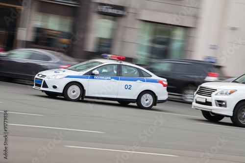 Police car in motion