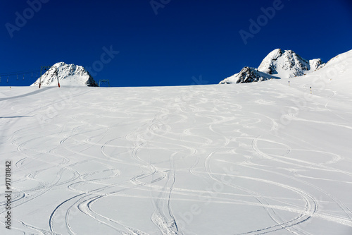 Fresh ski tracks on ski slope