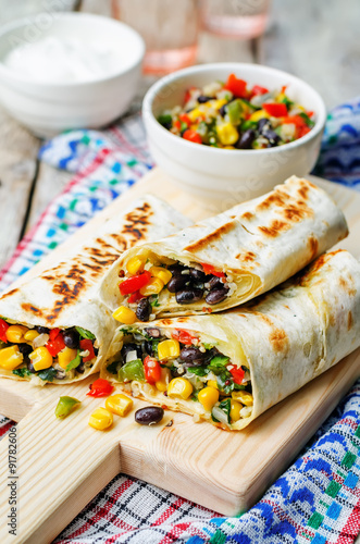 Fototapeta pepper corn black bean quinoa burritos