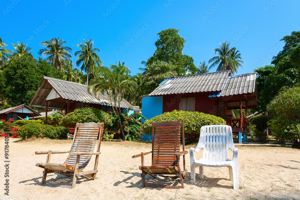 bungalow, chaise lounge on a beach