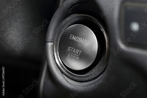 close up on a car start button © charnsitr