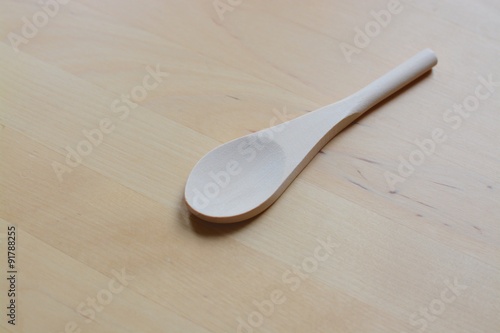 Wooden spoon on a wooden background