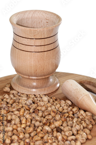 Soy beans on the table and wooden mortar