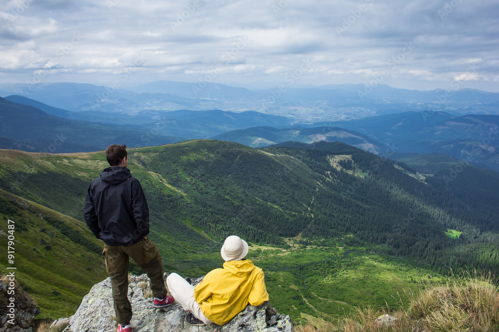 Fototapeta premium Two Man-climber at the top of the mountain Hoverla. 