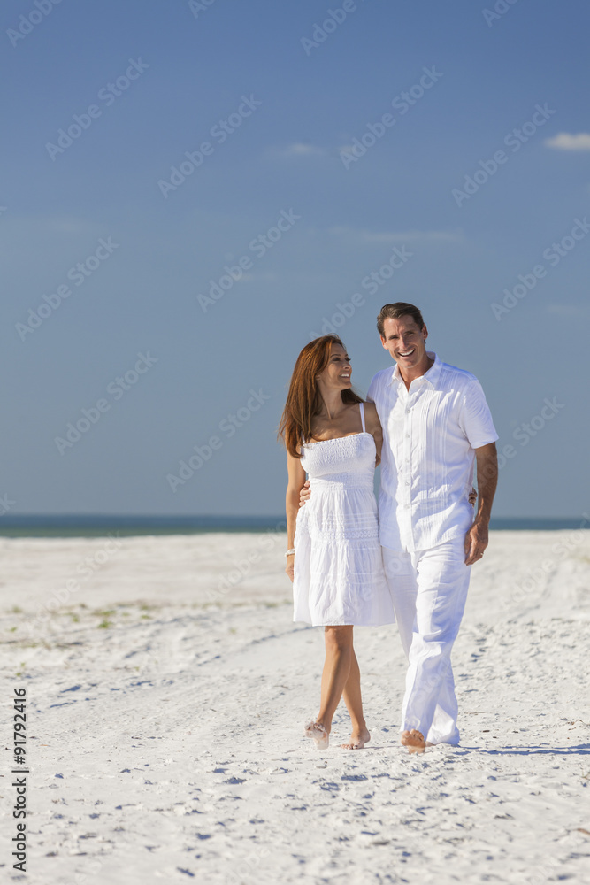 Man Woman Couple Walking on An Empty Beach Man Woman Couple Walking on An Empty Beach
