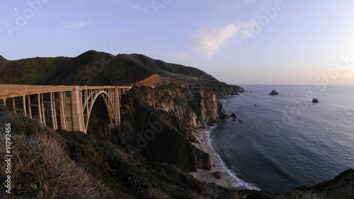 Time lapse of sun setting on the historic Bixby Creek Bridge and the Big Sur Coast in Big Sur, California.
