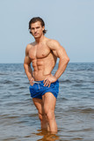 Muscular man on the beach