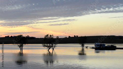 Campers watching the sunset from their RV at Far West Reservoir near Spenceville Wildlife Area, Yuba City, California. photo