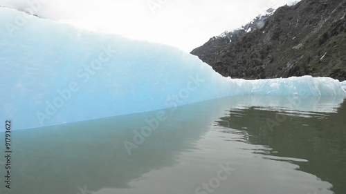 Close up tracking motion from a boat of an iceberg in Endicott Arm in Tracy Arm - Fords Terror Wilderness Area, Southeast Alaska. photo