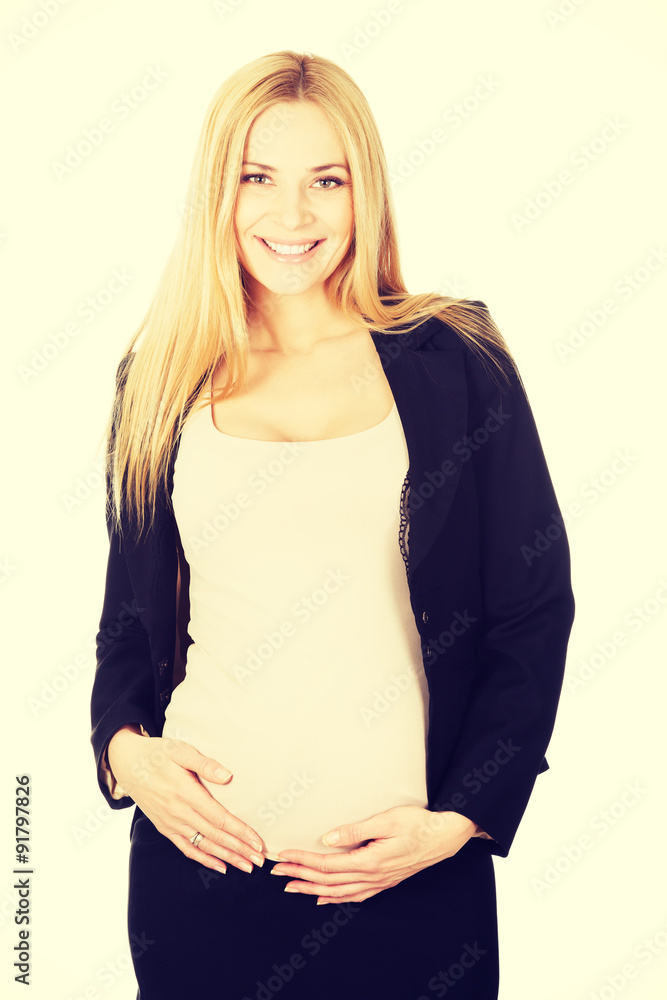 Pregnant woman in business suit. Pregnant woman in business suit.