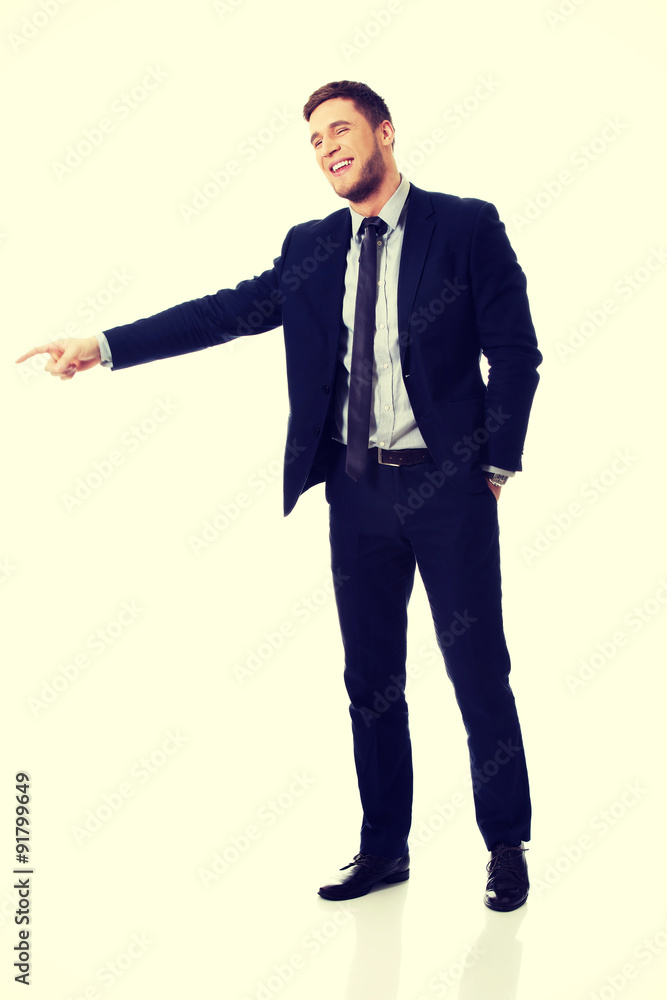 Happy businessman pointing his finger. Happy businessman pointing his finger.