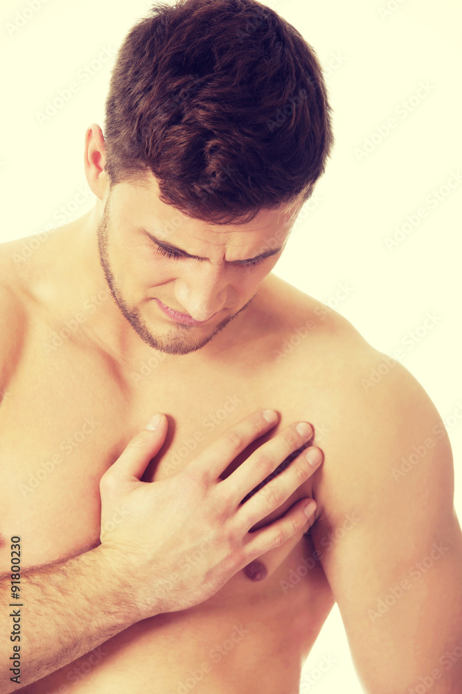 Athletic man feeling pain in his chest. Athletic man feeling pain in his chest.