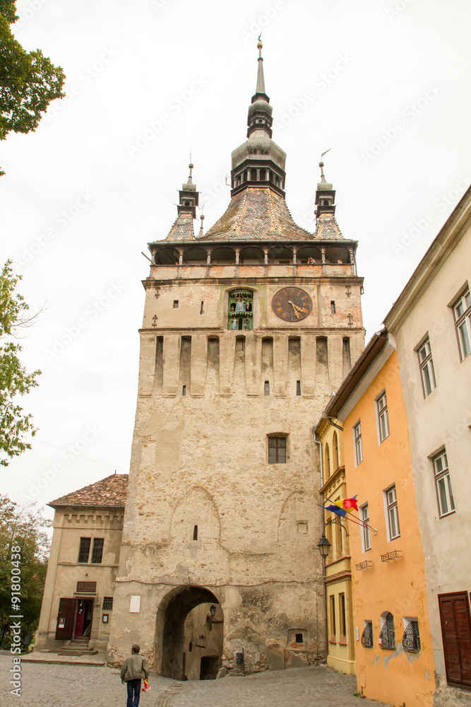 The Clock Tower on medieval street of Sighisoara, Transylvania, Romania, 10 September 2015