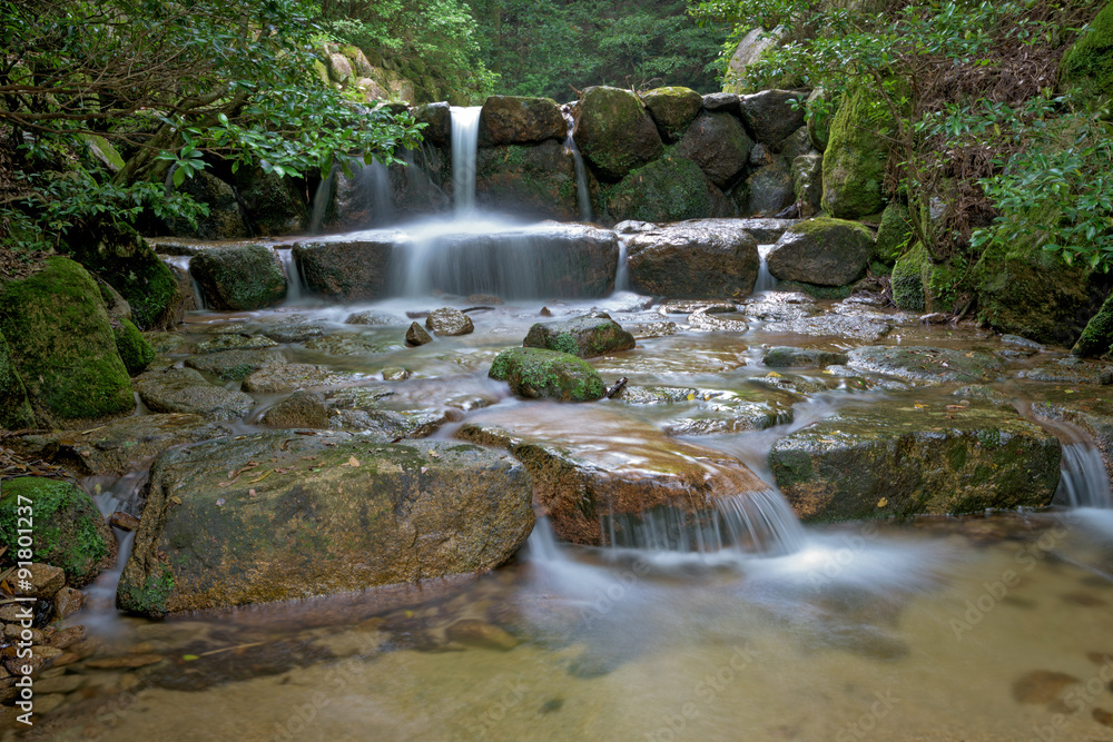Small waterfall on a river in Japan Small waterfall on a river in Japan