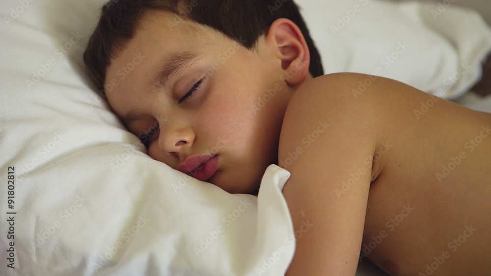 Portrait of сute boy is sleeping on a bed
Portrait of сute boy is sleeping on a bed