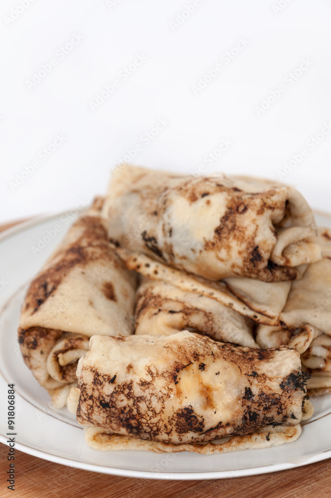 Stuffed rolled pancakes with sour cream fried bacon Stuffed rolled pancakes with sour cream fried bacon