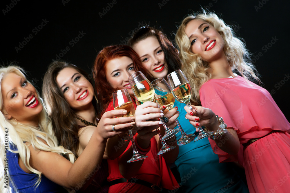 partying girls clinking flutes with sparkling wine partying girls clinking flutes with sparkling wine
