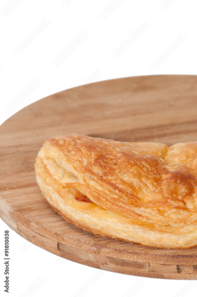Pizza pastry half on the wooden board Pizza pastry half on the wooden board
