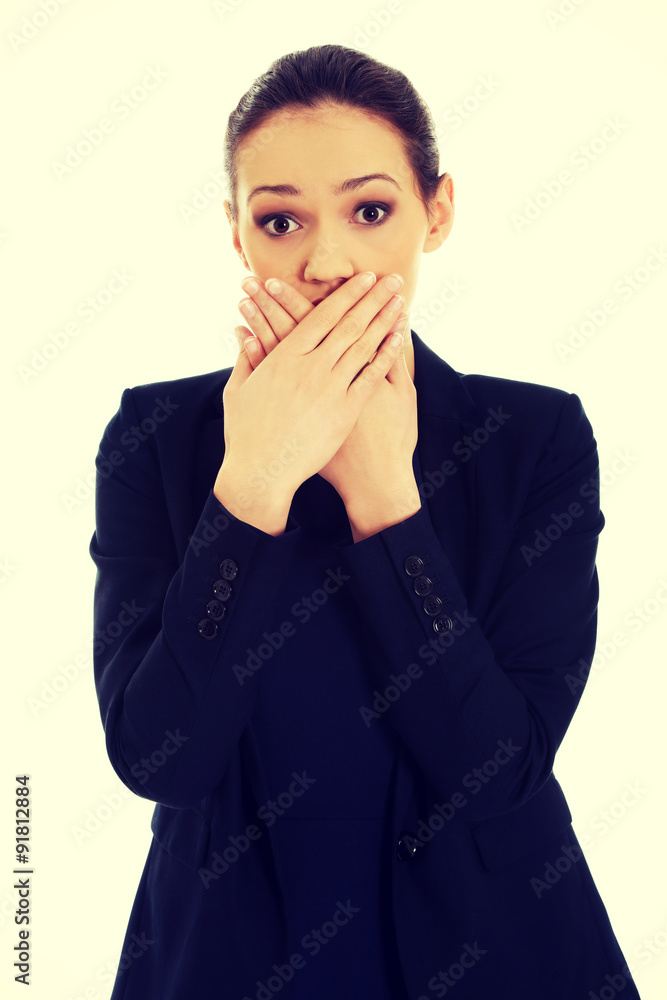 Excited young business woman covering her mouth. Excited young business woman covering her mouth.