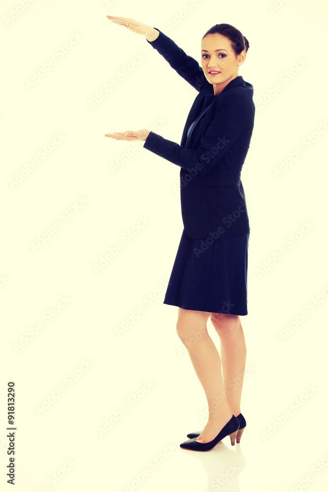 Businesswoman holding copy space in hands. Businesswoman holding copy space in hands.