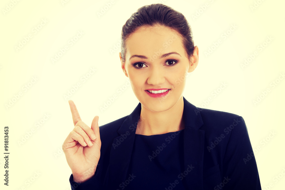 Businesswoman pointing up. Businesswoman pointing up.