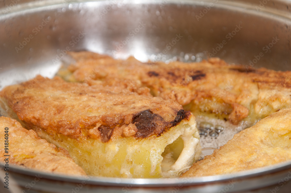 Frying paprika stuffed with cheese Frying paprika stuffed with cheese
