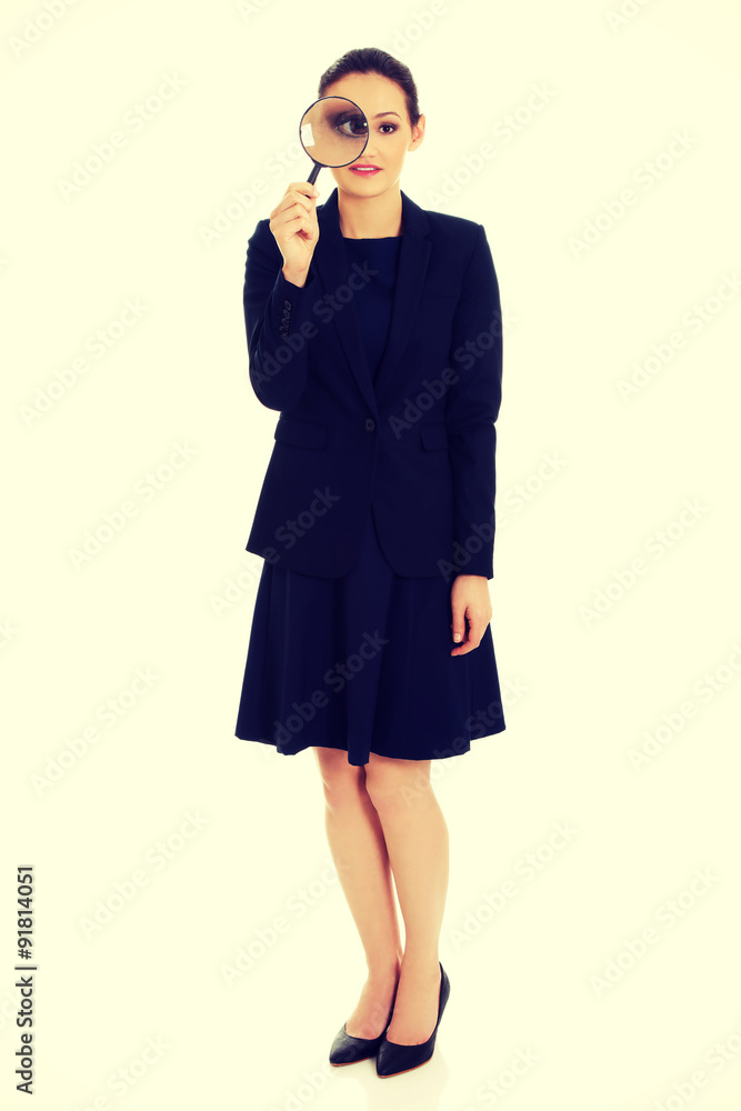 Businesswoman with magnifier glass. Businesswoman with magnifier glass.