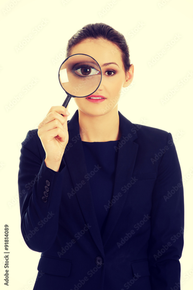 Businesswoman with magnifier glass. Businesswoman with magnifier glass.
