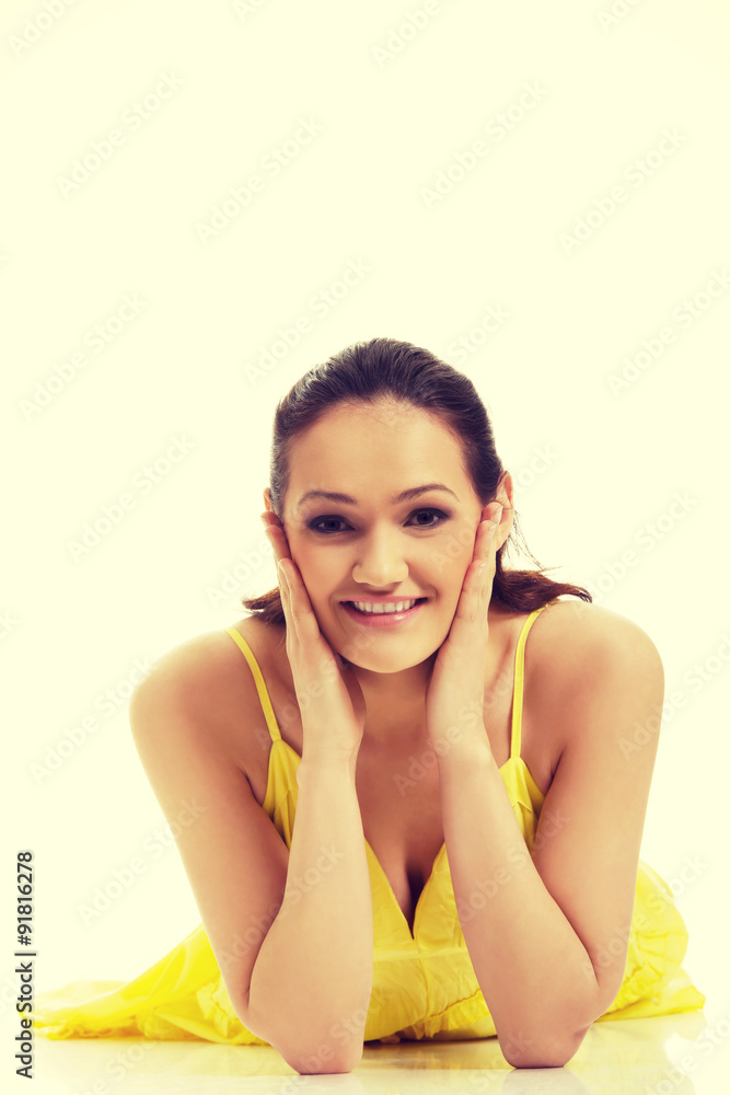 Beautiful woman lying in yellow dress. Beautiful woman lying in yellow dress.