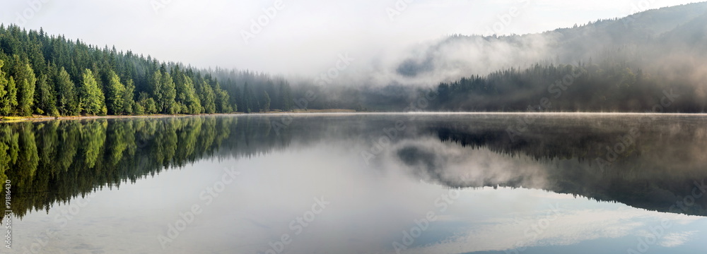 Naklejka premium Foggy Landscape. Misty landscape of Lake Saint Anne. 